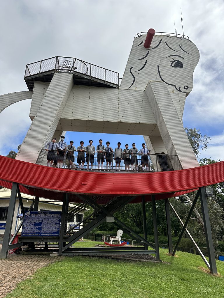 Students climbing the Big Rocking Horse