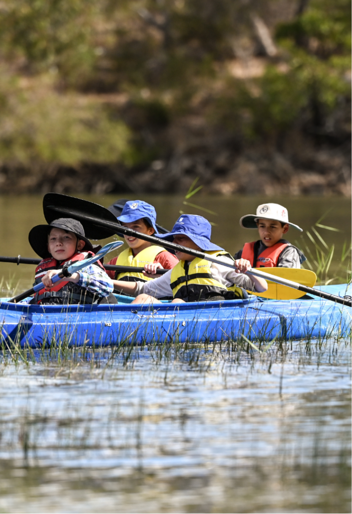 Students kayaking in a lake