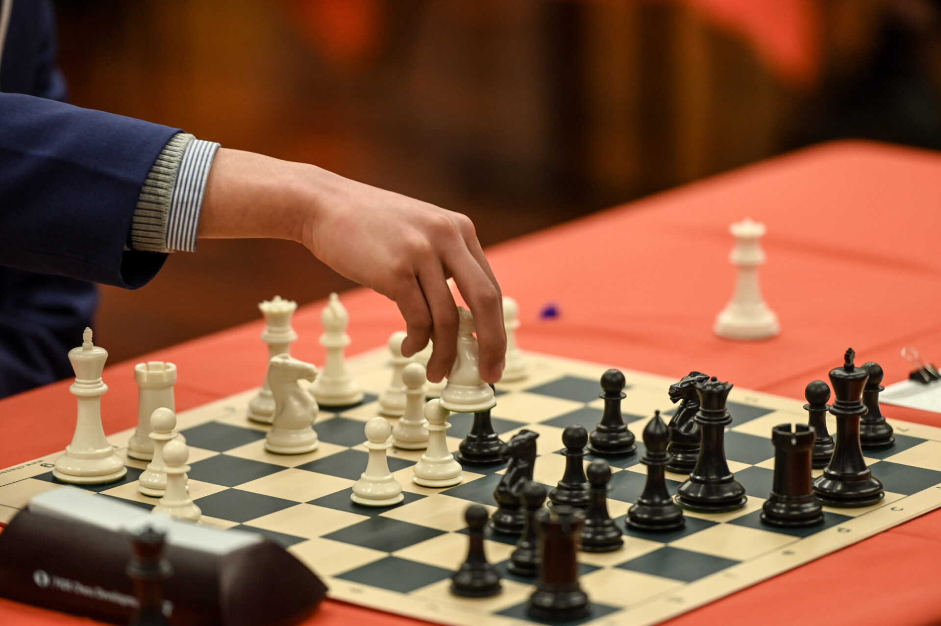 Student playing chess in a competition