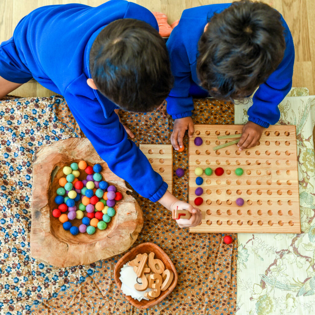 Two boys in the early learning centre learning and playing