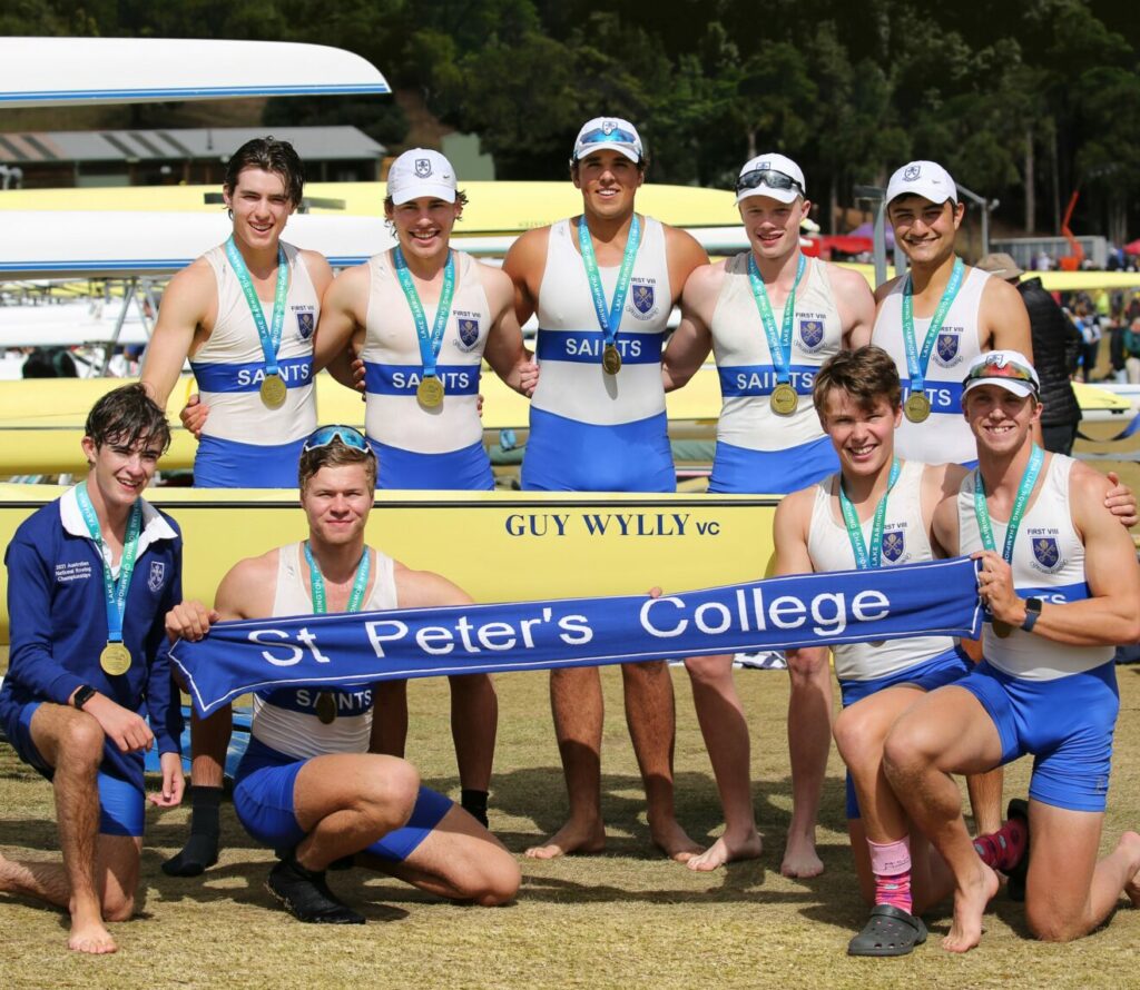 Boys who have just won a rowing race