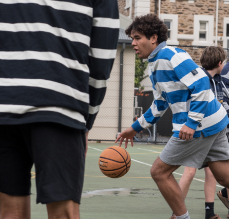 Student playing basketball