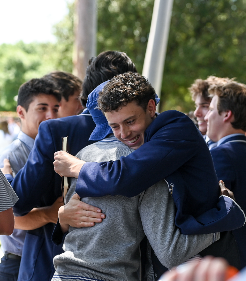 Two students hugging and celebrating