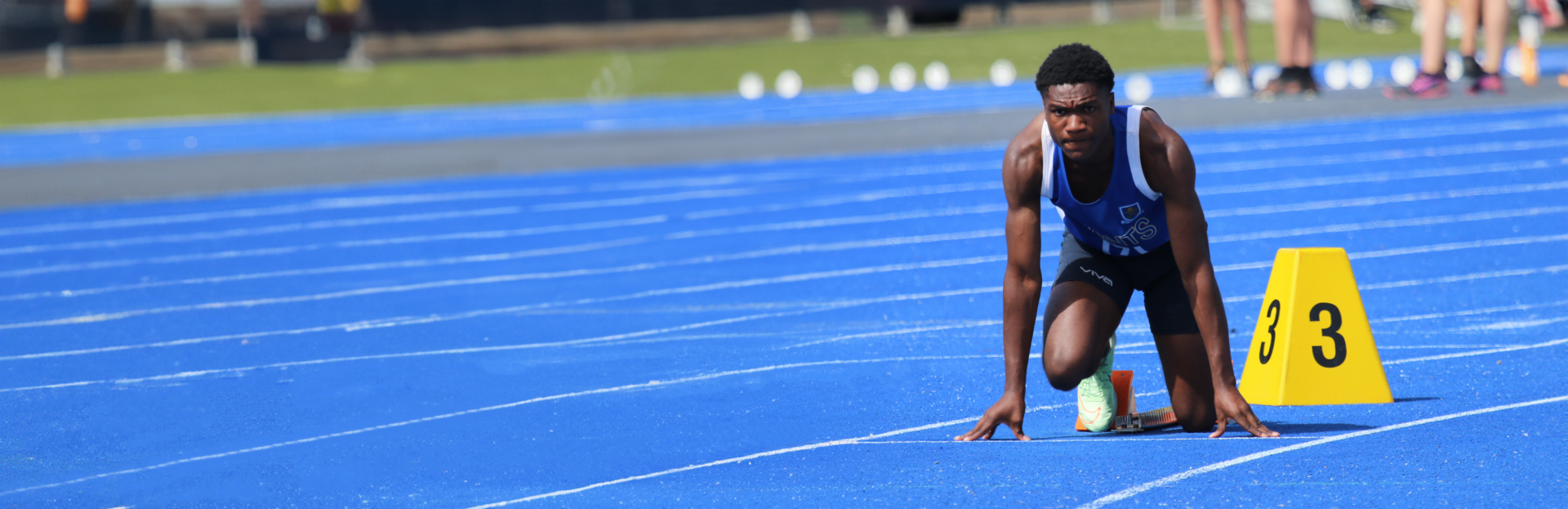 Student at the starting blocks of a athletics carnival